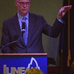 University of Alaska president Jim Johnsen delivers his State of the University address to the Juneau Chamber of Commerce on Thursday in the Hangar Ballroom. (James Brooks | Juneau Empire)