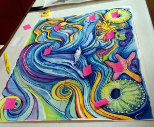 Artist Grace Wolf&rsquo;s piece is seen with the sticky notes indicating who bought each section at the Art by the Inch fundraiser in Petersburg. (Photo by Chelsea Tremblay)