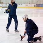 Steve Thompson, left, and Wylie Rogers, of Alaska Goaltending Academy, run a goaltending camp on the ice at Treadwell Arena on Wednesday. (Michael Penn | Juneau Empire)