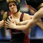 In this Feb. 18 photo, Euless Trinity&rsquo;s Mack Beggs, left, wrestles Grand Prairie&rsquo;s Kailyn Clay during the finals of the UIL Region 2-6A wrestling tournament at Allen High School in Allen, Texas. Beggs, who is transgender, is transitioning from female to male, won the girls regional championship after a female opponent forfeited the match. (Nathan Hunsinger | The Dallas Morning News)