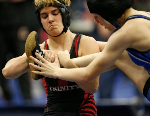 In this Feb. 18 photo, Euless Trinity&rsquo;s Mack Beggs, left, wrestles Grand Prairie&rsquo;s Kailyn Clay during the finals of the UIL Region 2-6A wrestling tournament at Allen High School in Allen, Texas. Beggs, who is transgender, is transitioning from female to male, won the girls regional championship after a female opponent forfeited the match. (Nathan Hunsinger | The Dallas Morning News)