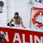 In this Feb. 2 photo, a man stands on a commercial fishing boat docked at Pier 38 in Honolulu. (Caleb Jones | The Associated Press)