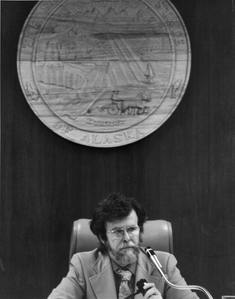 Rep. Mike Miller sits in the speaker&rsquo;s chair in the Alaska House of Representatives. (Courtesy of Kevin Miller)