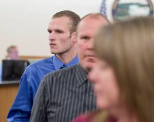 Ty Alexander Grussendorf, 22, follows his parents out of Juneau Superior Court after a trial date-setting hearing on Wednesday. (Michael Penn | Juneau Empire)