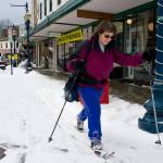 Jodie Pessolano takes advantage of recent snow to ski along Front Street on Thursday. (Michael Penn | Juneau Empire)