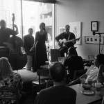 Marian Call pictured with microphone. Photo courtesy of Brian Adams.