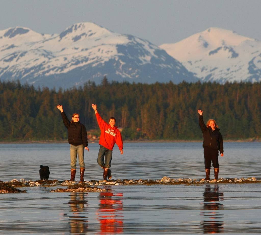 Merlin, Jayleen, Jason, and Eileen Beedle. The Beedle&rsquo;s Shelter Island cabin is directly behind Jason. Photo by Jay Beedle.