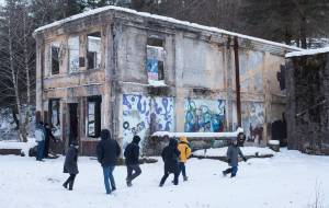 Members of the Arctic Council take a tour Treadwell Historic Preservation and Restoration Society member Wayne Jensen, right, on Monday, March 6, 2017. The roof of the &ldquo;New Office Building&rdquo; was recently removed and will be replaced this summer to help maintain the structure. The Arctic Council is holding their meetings in Juneau this week. (Michael Penn | Juneau Empire)