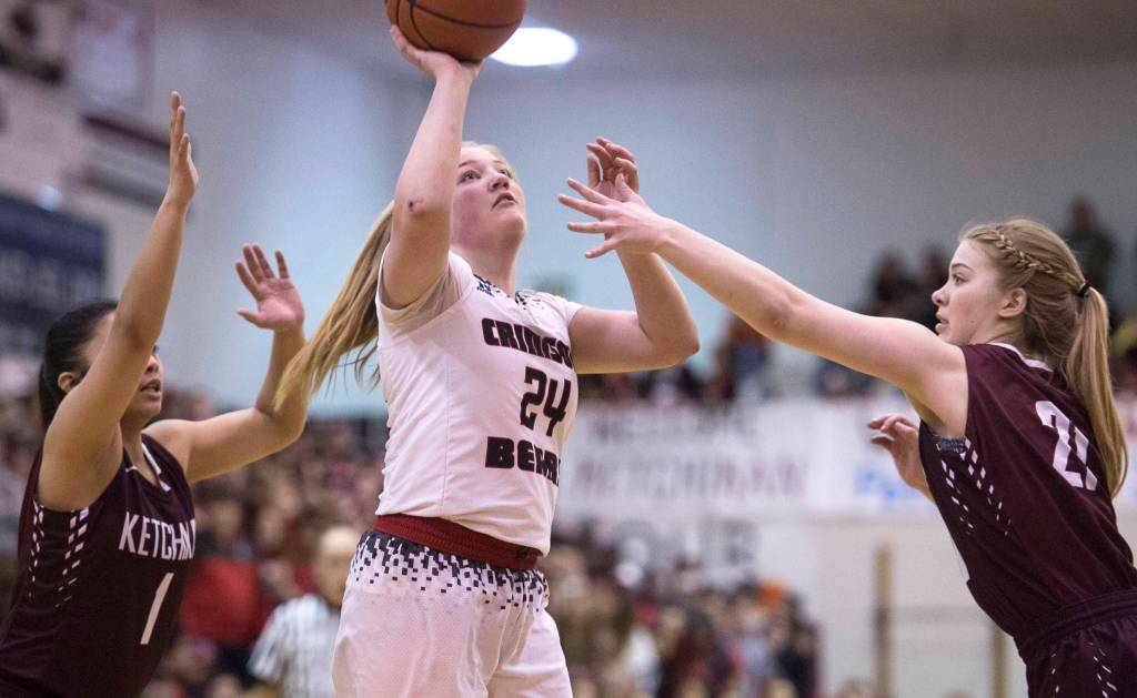 Juneau-Douglas&rsquo; Morgan Balovich shoots against Ketchikan&rsquo;s AJ Dela Cruz, left, and Ashley Hoffine during the Region V Basketball finals at JDHS on Friday. Ketchikan won 41-39 to force a playoff game on Saturday. (Michael Penn | Juneau Empire)