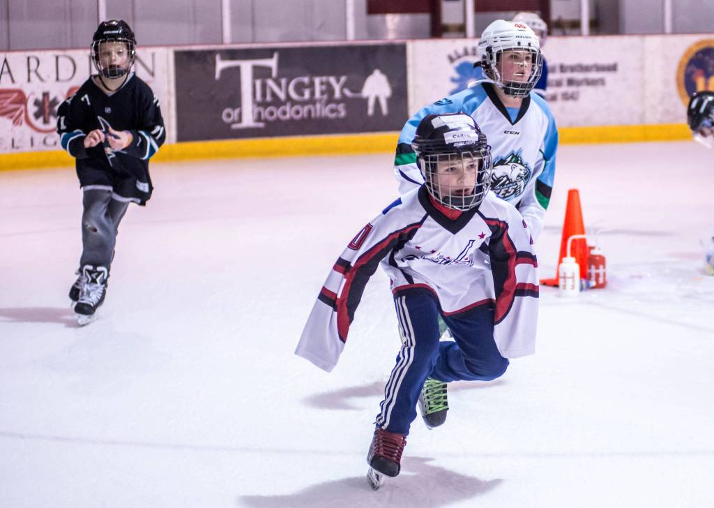 Caden Johns takes a turn during the home stretch of the Squirt Skate-a-Thon. (Courtesy of Steve Quinn)