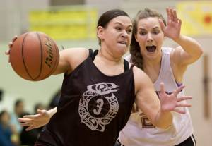 Criag&rsquo;s Molly Sharp, left, drives to the basket against Haines&rsquo; Samantha Clay during their Womens bracket game in the 2016 Juneau Lions Club 70th Gold Medal Basketball Tournament at Juneau-Douglas High School. Craig won 59-45. (Michael Penn | Juneau Empire File)
