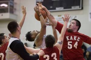 Kake&rsquo;s Deion Jackson, right, knocks the ball away from Angoon&rsquo;s JJ Jack-Nixon in the B bracket on the first day of the Lion&rsquo;s Club&rsquo;s Gold Medal Basketball Tournament at Juneau-Douglas High School on Sunday, March 19, 2017. Kake won 86-73. (Michael Penn | Juneau Empire)