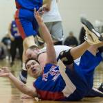 Filcom&rsquo;s Franz Kugelmann passes after stealing the ball from AK Caches/James Gang&rsquo;s Sean Smith during their C bracket game at the Lions Club&rsquo;s Gold Medal Basketball Tournament at Juneau-Douglas High School on Sunday, March 19, 2017. Filcom won 59-51. (Michael Penn | Juneau Empire)