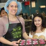 Bartlett Regional Hospital nutrition and dietetic technician Theresa Reynolds bakes up beet cupcakes with avocado icing with help from Abigail. (Courtesy photo)