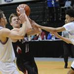 Juneau&rsquo;s Kolby Hoover is harassed by East&rsquo;s Kaeleb Johnson and Trey Huckabay. (Michael Dinneen | For the Juneau Empire)