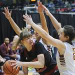Juneau&rsquo;s Caitlin Pusich works against the defense of a pair of Dimond defenders.(Michael Dinneen | For the Juneau Empire)