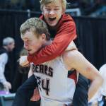 Juneau&rsquo;s Erik Kelly and Tristin Eidsness celebrate their one-point win over West Valley. (Michael Dinneen | For the Juneau Empire)