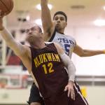 Klukwan&rsquo;s Jason Shull drives to the basket against Juneau James Gang&rsquo;s Billy Ehlers in the C Bracket finals of the Lions Club&rsquo;s 71st Gold Medal Basketball Tournament at Juneau-Douglas High School on March 25, 2017. Klukwan won in triple overtime 107-97. (Michael Penn | Juneau Empire)