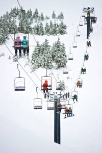 Skiers ride the Black Bear Chairlift on its opening day at Eaglecrest in January 2015. (Michael Penn | Juneau Empire file)