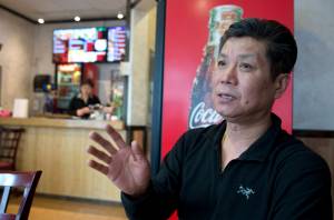 Owner Dong Lee talks on Monday, March 27, 2017, about his new Korea Garden restaurant that opened on Front Street. (Michael Penn | Juneau Empire)