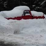 Spring, when will you spring? A buried car on March 25 at the University of Alaska Southeast. (Photo by John d&rsquo;Armand)