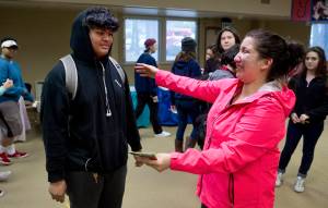 Kristen Hemlock, mother to 5-year-old Mason Varner, cries as she reaches to hug Riley John, 14, at a ceremony to recognize John at Yaakoosge Daakahidi Alternative High School on Friday, March 31, 2017. John, with help from friend Seth Gerrin, 16, rescued Varner from Gold Creek on Thursday.