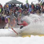 A 2012 Slush Cup skier tries to maintain his balance before hundreds of curious onlookers. The event is a popular spectator sport as many contestants endure comical crashes into the water. Courtesy Eaglecrest Ski Area.