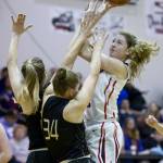 Juneau-Douglas&rsquo; Kendyl Carson puts up a shot against Marysville&rsquo;s Maddy Grandbois, center, and Carley Wika during the Capital City Classic at JDHS on Friday, Dec. 30, 2016. (Michael Penn | Juneau Empire File)