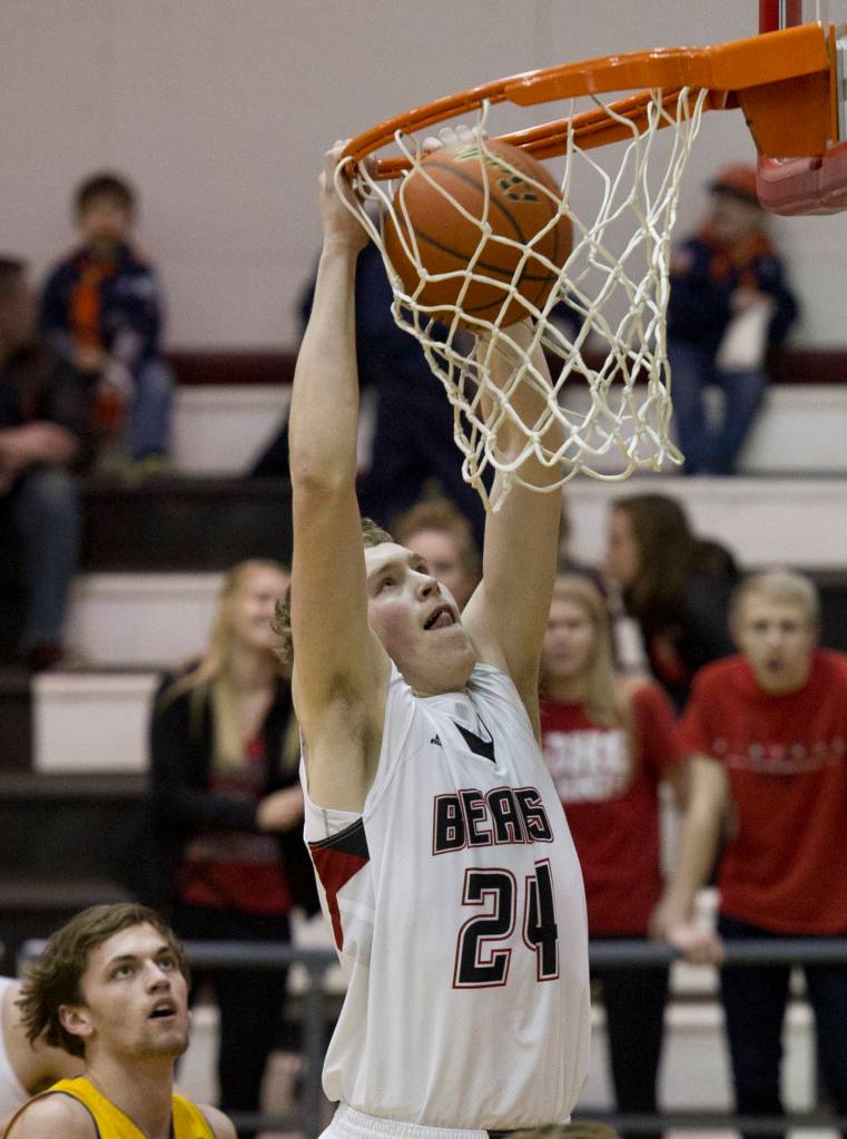 Juneau-Douglas&rsquo; Erik Kelly dunks the ball against Lathrop at JDHS on Friday, Feb. 10, 2017. JDHS won 50-43. (Michael Penn | Juneau Empire File)