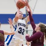 Thunder Mountain&rsquo;s Nina Fenumiai gets a shot off over Ketchikan&rsquo;s Chanell Browne, left, and Payton Simmons at TMHS on Thursday, Feb. 23, 2017. Ketchikan won 55-26. (Michael Penn | Juneau Empire)