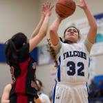 Thunder Mountain&rsquo; Nina Fenumiai shoots against Juneau-Douglas&rsquo; Meghna Bathija at TMHS on Friday, March 3, 2017. JDHS won 49-42. (Michael Penn | Juneau Empire)