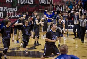 Thunder Mountain&rsquo;s Garth Tupou screams in celebration after his shot at the buzzer gave TMHS the upset over Juneau-Douglas at JDHS on Friday, Feb. 3, 2017. TMHS won 49-48. (Michael Penn | Juneau Empire)