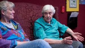 Juneau Pioneers&rsquo; Home resident Phyllis Woodman, right, talks about the grief caused by the Alaska Senate&rsquo;s proposed budget cuts to the home&rsquo;s residents and staff on Tuesday. Michael Penn |  Juneau Empire Juneau Pioneers&rsquo; Home resident Phyllis Woodman, right, talks about the grief caused by the Alaska Senate&rsquo;s proposed budget cuts to the home&rsquo;s residents and staff on Tuesday, April 11, 2017. A resident of the home for four years, Woodman was being visited by Carol Schriver, left. After outcry from the community, state senators are now asking Gov. Bill Walker to save the Pioneer Homes. (Michael Penn | Juneau Empire)