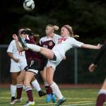 Juneau-Douglas&rsquo; Erika Holst competes against Ketchikan&rsquo;s Neva Garner at Adair-Kennedy Memorial Park on Thursday, April 13, 2017. (Michael Penn | Juneau Empire)