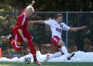 Juneau-Douglas&rsquo; Ben Carter competes against West Valley&rsquo;s Ricky Stanton at Adair-Kennedy Memorial Field on Friday. (Michael Penn | Juneau Empire)