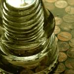 A glass wire insulator on a counter top covered with copper pennies. Photo by Ray Tsang.