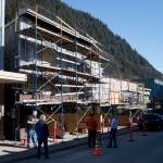 MICHAEL PENN | JUNEAU EMPIRE A fire started on the outside wall Saturday evening caused about $30,000 damage to a Seward Street building that includes Art Sutch Photography shop.