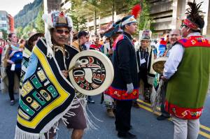 Fifty Tlingit, Haida, and Tsimshian groups dressed in traditional regalia take part in the Grand Entrance Processional down Willoughby Street from Elizabeth Peratrovich Hall to Centennial Hall to kickoff the four days of Celebration in June 2016. (Michael Penn | Juneau Empire file)