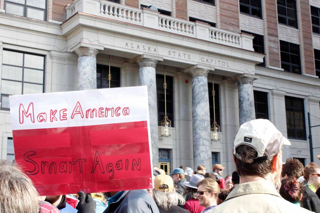 Demonstrators held up signs promoting science, the environment and the pursuit of facts at Saturday&rsquo;s March for Science. (Alex McCarthy | Juneau Empire)