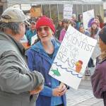 Molly Zaleski talks with other demonstrators at Saturday&rsquo;s March for Science. The march was one of more than 600 worldwide. (Alex McCarthy | Juneau Empire)