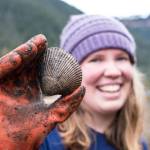 A cockle-collector in Sitka holds up a cockle. Bethany Goodrich | Capital City Weekly
