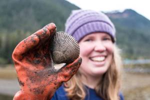 A cockle-collector in Sitka holds up a cockle. Bethany Goodrich | Capital City Weekly
