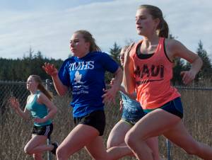Members of the Thunder Mountain High School track and field team practice at TMHS on Thursday, April 13, 2017. (Michael Penn | Juneau Empire)