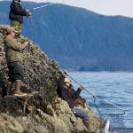 Fisherman fish for returning king salmon off the rocks at False Outer Point in May 2015 during the annual Spring King Salmon Derby. The derby was cancelled this year after an emergency order from the Alaska Department of Fish and Game closed King salmon fishing until June 14. (Michael Penn | Juneau Empire File)