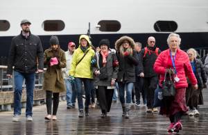 Passengers walk off Holland Amerca Line&rsquo;s Nieuw Amsterdam on Monday. (Michael Penn | Juneau Empire)