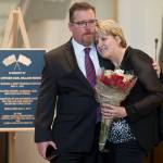 Former Juneau firefighter Dave Stott gives Sue Reishus-O&rsquo;Brien a hug at a remembrance ceremony at the Father Andrew P. Kashevaroff Building on Thursday, May 4, 2017, on the 25th anniversary of the death of Sue&rsquo;s then-husband, Police Officer Karl William Reishus. Stott was injured in the same training accident that killed Reishus. (Michael Penn | Juneau Empire)