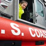 Sawyer Vreeland, 3, climbs in a U.S. Coast Guard fast response boat on display at the Juneau Maritime Festival at Marine Park in Juneau on Saturday, May 7, 2016. (Michael Penn | Juneau Empire File)