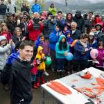 Irat De La Mora acknowledges the crowd after showing his talent for slicing up coho salmon at the Juneau Maritime Festival at Marine Park in Juneau on Saturday, May 7, 2016. (Michael Penn | Juneau Empire File)