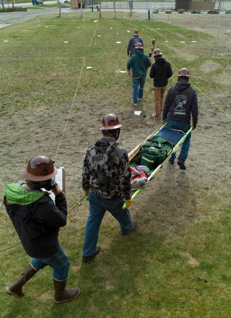 Coeur&rsquo;s Kensington Mine Rescue team Eddie Petrie, Mike Walters, Kelly Rickards, Jason Cameron and Alan Gordon, follow team trainer Jeremy Whitmore onto the practice field at Savikko Park on Tuesday, May 2, 2017. The Kensington team and one from Hecla&rsquo;s Green Creek Mine will compete next week at the Central Mine Rescue Competition in Kellogg, Idaho. (Michael Penn | Juneau Empire)