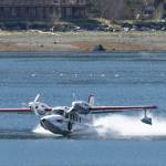 Ross Mahon and Ben Ellison touchdown in Juneau downtown harbor in a plane they&rsquo;re calling a Gweduck (misspelled on purpose) on Thursday, May 4, 2017. A &ldquo;new twist on an old design,&rdquo; the plane looks like an vintage aircraft but is made with modern materials. It began as a side project for the two aeronautical engineers from Seattle and is now a reality. It made the stop in Juneau on Thursday on its way to Anchorage. (Michael Penn | Juneau Empire)
